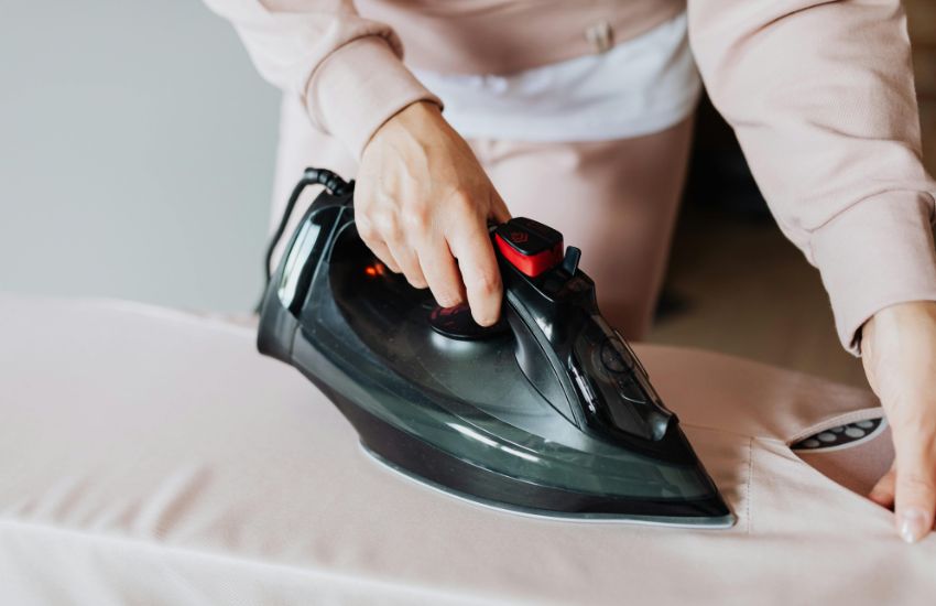 expert steam press for perfectly finished garments-Grand Power Cleaners